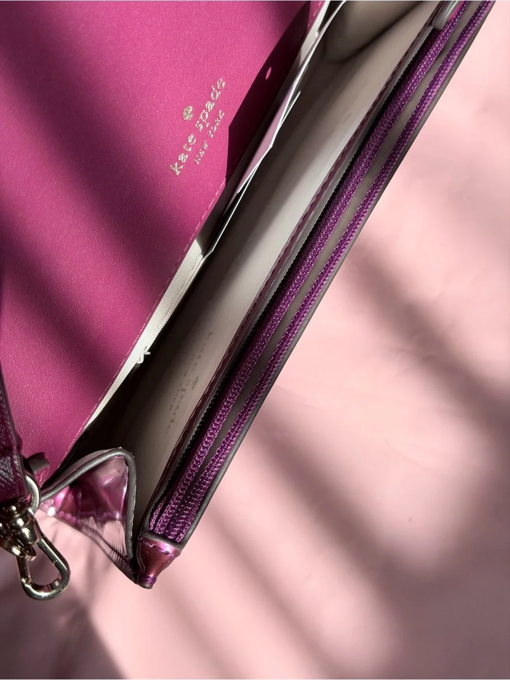Kate Spade Glossy Magenta Patent Leather Clutch with metal logo plate